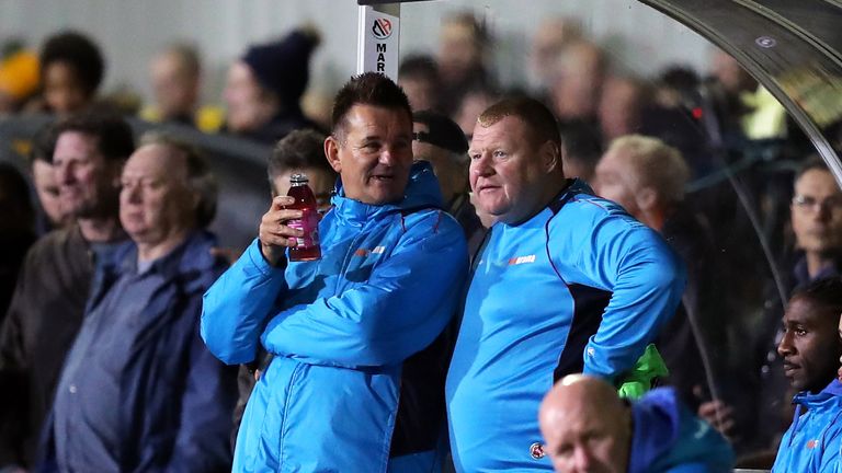 Wayne Shaw in conversation with Sutton United manager Paul Doswell during the FA Cup Fifth Round