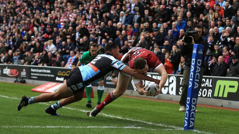 Wigan Warriors' Joe Burgess scores the opening try of the game against Cronulla-Sutherland Sharks during the 2017 Dacia World Club Series match