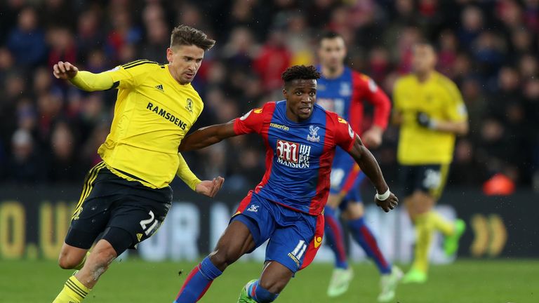 LONDON, ENGLAND - FEBRUARY 25: Gaston Ramirez of Middlesbrough (L) and Wilfried Zaha of Crystal Palace (R) battle for possession during the Premier League 