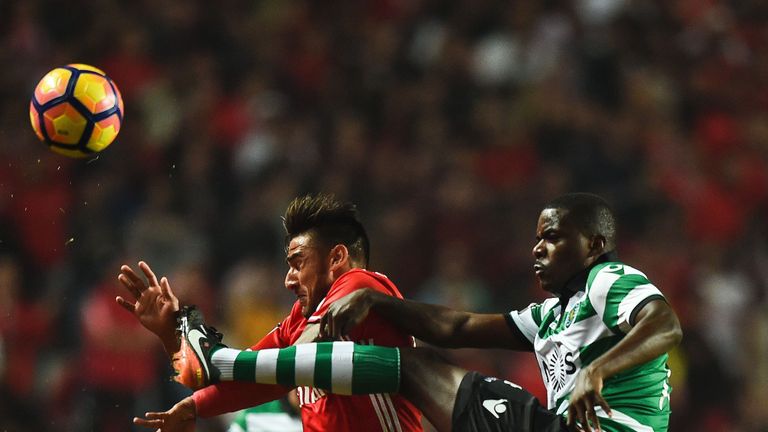 Sporting midfielder William Carvalho (R)  battles with Benfica's Eduardo Salvio.