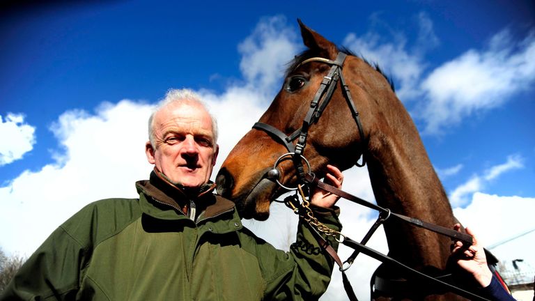 Willie Mullins and Douvan pose for a picture during a visit to his stables at Closutton, Carlow, Ireland.