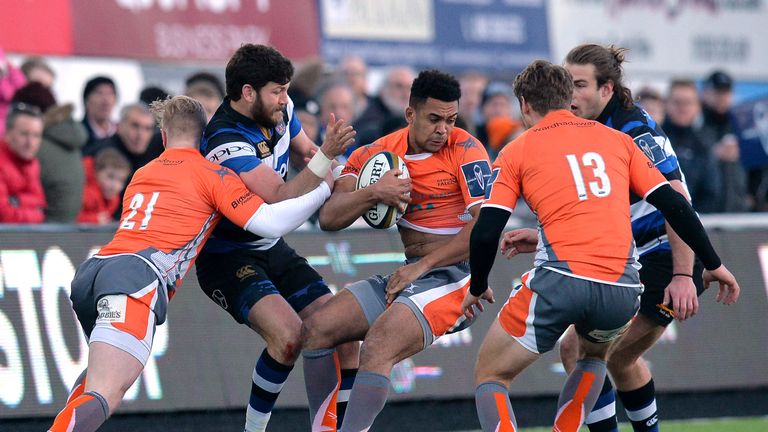 NEWCASTLE UPON TYNE, ENGLAND - FEBRUARY 04: Zach Kibirige of Newcastle Falcons is tackled by Jeff Williams of Bath Rugby during the Anglo-Welsh Cup match b