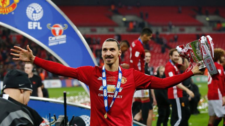 Zlatan Ibrahimovic celebrates with the EFL Cup