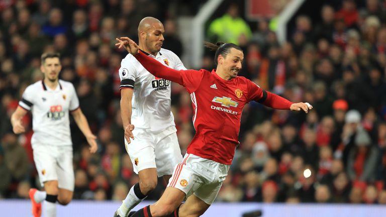 Zlatan Ibrahimovic of Manchester United tumbles under pressure from Watford's Younes Kaboul 