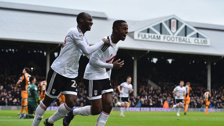 Fulham's Ryan Sessegnon (R) celebrates with Sone Aluko (L) after scoring during the English FA Cup fourth round win over Hull City