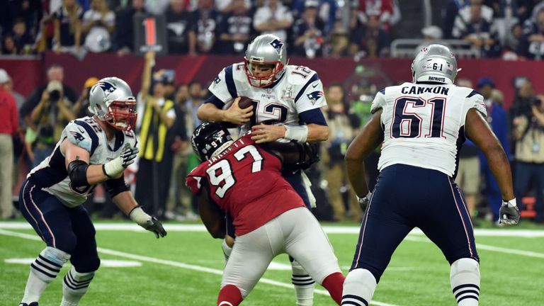 Tom Brady #12 of the New England Patriots is sacked by Grady Jarrett #97 of the Atlanta Falcons in the fourth quarter during Super Bowl 51 at NRG Stadium o