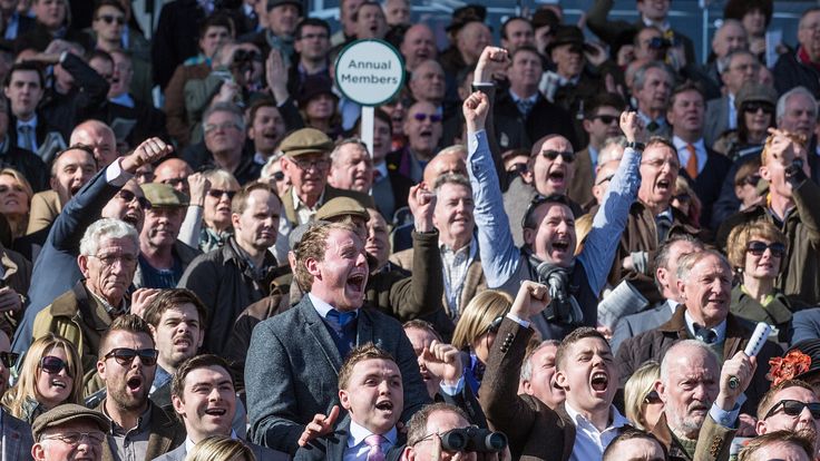 CHELTENHAM, ENGLAND - MARCH 10:  Racegoers cheer during the first race at Cheltenham Racecourse on the first day of the Cheltenham Festival on March 10, 20