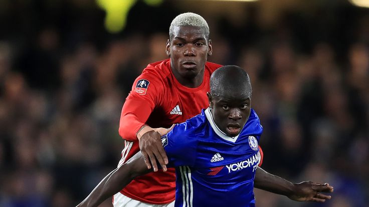 Paul Pogba and N'Golo Kante battle for the ball during the FA Cup Quarter-Final at Stamford Bridge