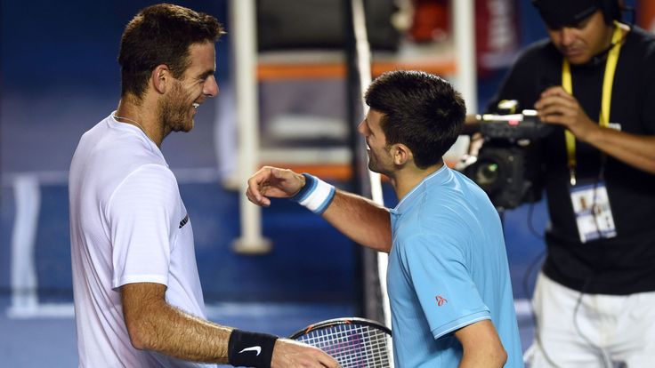 Serbia's Novak Djokovic (R) speaks to Argentina's Juan Martin del Potro after winning the second round match on the third day of the Mexican Tennis Open