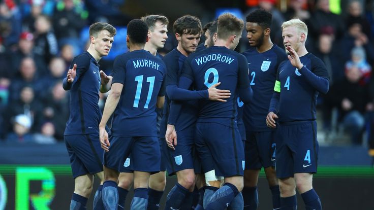 RANDERS, DENMARK - MARCH 27:  Solly March of England (L) celebrates as scores their second goal with team mates during the U21 international friendly match