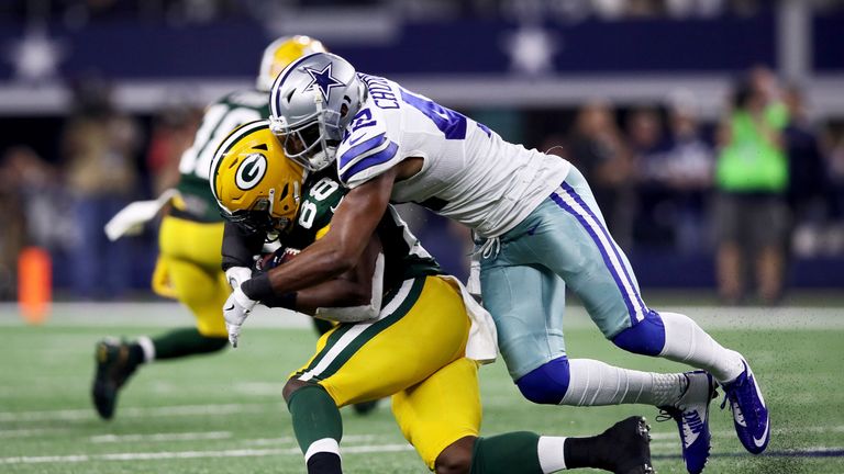 ARLINGTON, TX - JANUARY 15:  Barry Church #42 of the Dallas Cowboys tackles Ty Montgomery #88 of the Green Bay Packers in the second half during the NFC Di