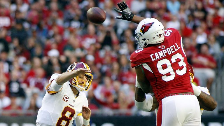 GLENDALE, AZ - DECEMBER 04:  Calais Campbell #93 of the Arizona Cardinals leaps to block the pass of quarterback Kurk Cousins #8 of the Washington Redskins