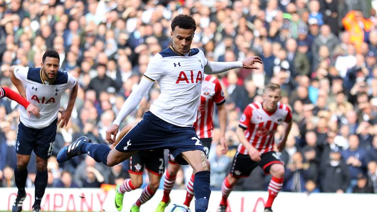 Dele Alli of Tottenham Hotspur scores his sides second goal from the penalty spot during the Premier League match against Southampton

