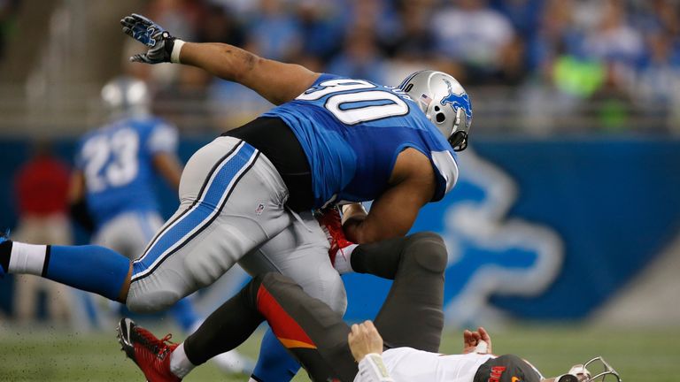 DETROIT, MI - DECEMBER 07: Ndamukong Suh #90 of the Detroit Lions sacks a Josh McCown #12 of the Tampa Bay Buccaneers. Ndamukong Suh #90 was given a penalt