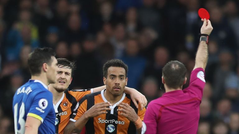Tom Huddlestone reacts as he sent off by referee Paul Tierney during the Premier League match between Everton and Hull City