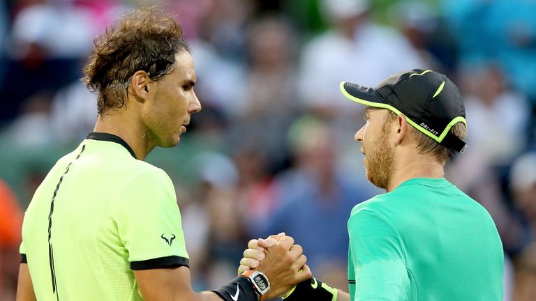 Rafael Nadal and Dudi Sela shake hands after the Spaniard's easy victory