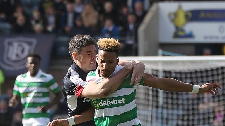 Darren O'Dea of Dundee vies with Scott Sinclair of Celtic