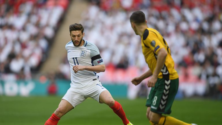 LONDON, ENGLAND - MARCH 26:  Adam Lallana of England takes on Egidijus Vaitkunas of Lithuania during the FIFA 2018 World Cup Qualifier between England and 