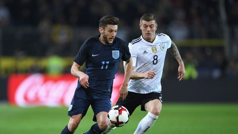 DORTMUND, GERMANY - MARCH 22: Adam Lallana of England (L) is put under pressure from Toni Kroos of Germany (R) during the international friendly match betw