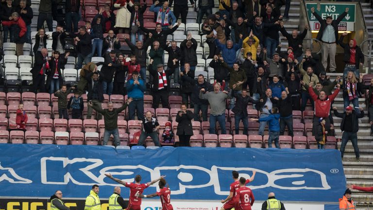WIGAN, ENGLAND- MARCH 11:  Aden Flint of Bristol City celebrates after he scores the winner during the Sky Bet Championship match between Wigan Athletic an