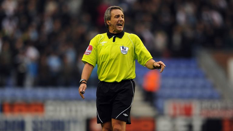 Referee Alan Wiley officiates during the English Premier League football match between Wigan Athletic and Manchster City at the DW Stadium in Wigan, north-