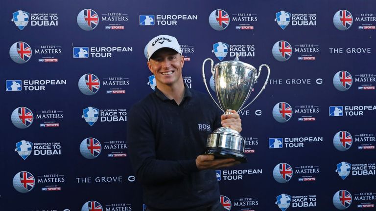 WATFORD, ENGLAND - OCTOBER 16:  Alex Noren of Sweden poses with the trophy following his victory during the fourth round of the British Masters at The Grov