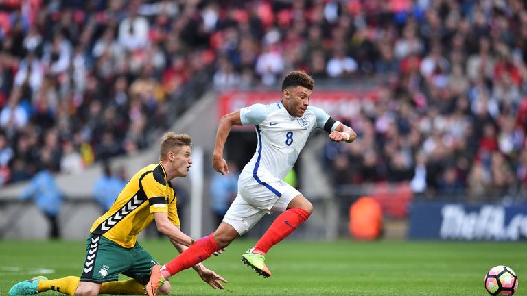 England's midfielder Alex Oxlade-Chamberlain (R) runs away from Lithuania's midfielder Vykintas Slivka during the World Cup 2018 qualification football mat