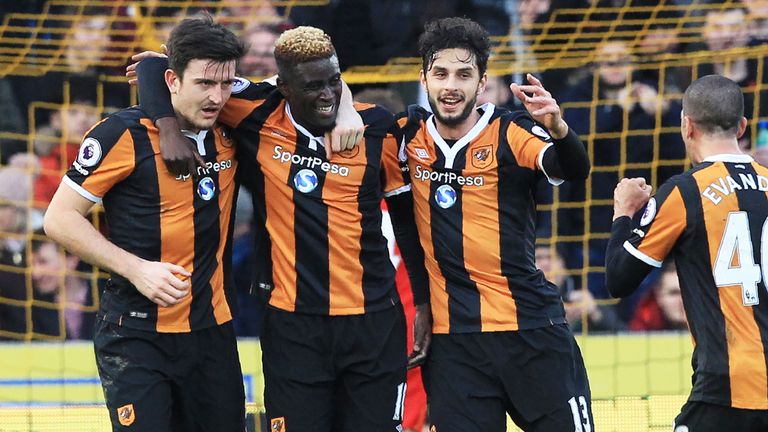 Alfred N'Diaye (2nd L) celebrates with team-mates after scoring the opening goal against Liverpool