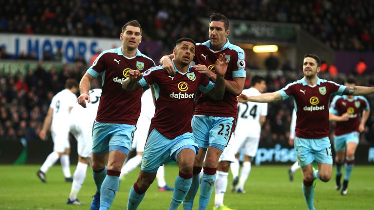 SWANSEA, WALES - MARCH 04:  Andre Gray of Burnley celebrates scoring his sides first goal with his Burnley team mates during the Premier League match betwe
