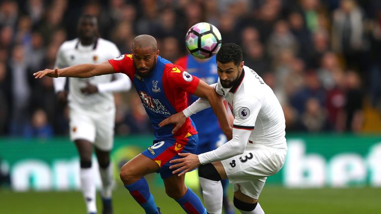 LONDON, ENGLAND - MARCH 18: Andros Townsend of Crystal Palace (L) and Miguel Britos of Watford (R) battle for possession during the Premier League match be