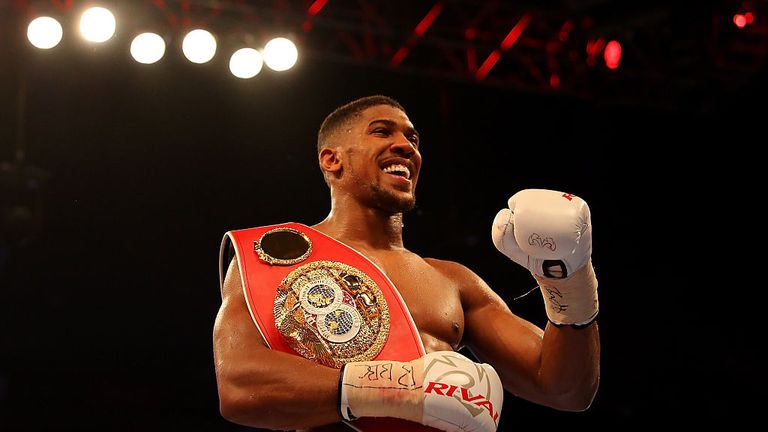 Anthony Joshua of Great Britain celebrates after defeating Dominic Breazeale of The USA during their IBF World Heavyweight Cham