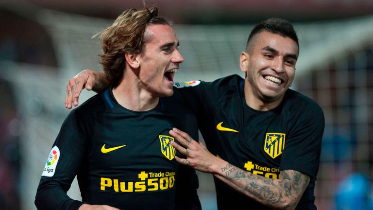 Atletico Madrid's French forward Antoine Griezmann (L) celebrates with Argentinian midfielder Angel Correa after scoring during the Spanish league football
