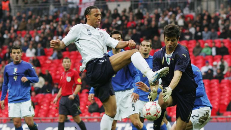 LONDON - MARCH 24:  Anton Ferdinand of England challenges Gianluca Curci of Italy during the U21 International Friendly match between England and Italy at 
