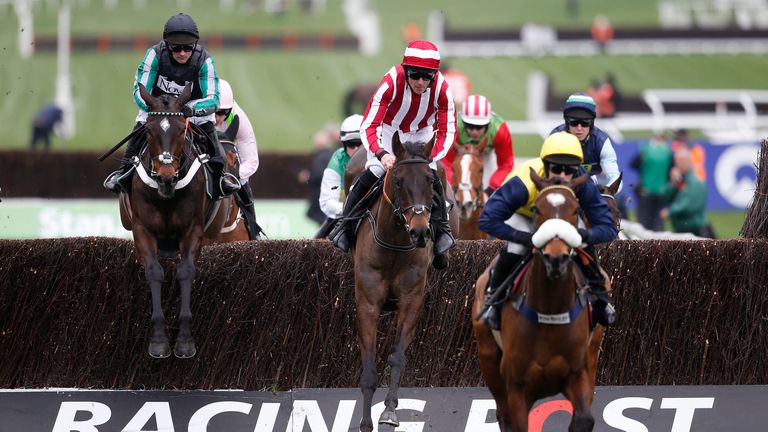 CHELTENHAM, ENGLAND - MARCH 14: Nico de Boinville ridng Altior (L) on their way to winning The Racing Post Arkle Challenge Trophy Novices Steeple Chase at 