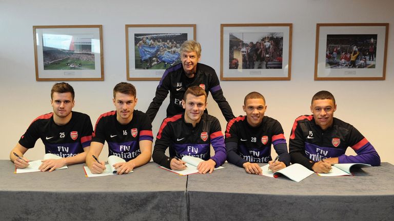 Arsene Wenger poses with Arsenal's 'British core' in December 2012