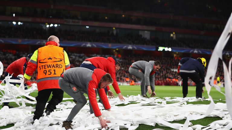 LONDON, ENGLAND - MARCH 07:  Streamers are removed from the pitch during the UEFA Champions League Round of 16 second leg match between Arsenal FC and FC B
