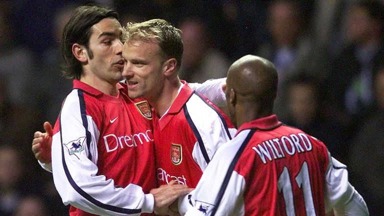 Dennis Bergkamp celebrates his goal against Newcastle United at St James' Park with team-mates Robert Pires and Sylvain Wiltord in 2002