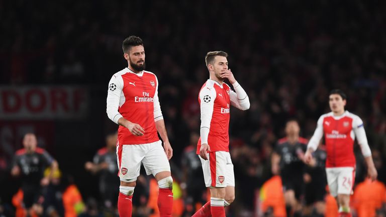 LONDON, ENGLAND - MARCH 07:  Olivier Giroud and Aaron Ramsey of Arsenal look dejected during the UEFA Champions League Round of 16 second leg match between