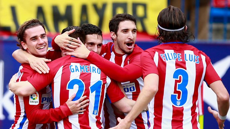 MADRID, SPAIN - MARCH 05:  Kevin Gameiro (2ndL) of Atletico de Madrid celebrates scoring their second goal with teammates Antoine Griezmann (L), Koke (3dL)