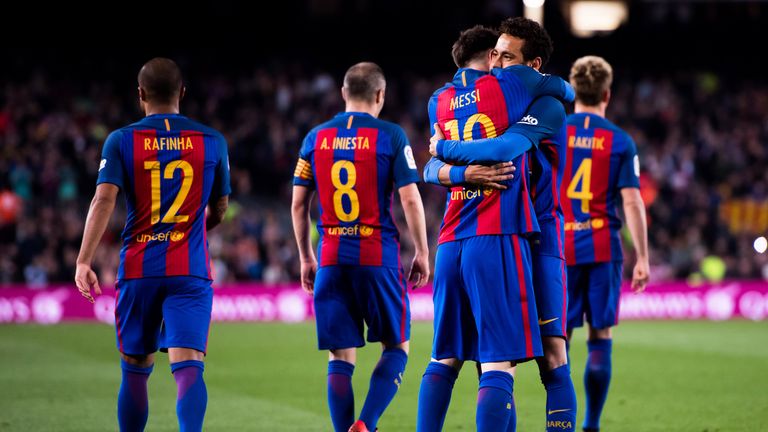 Lionel Messi embraces team-mate Neymar Jr after scoring Barcelona's third goal