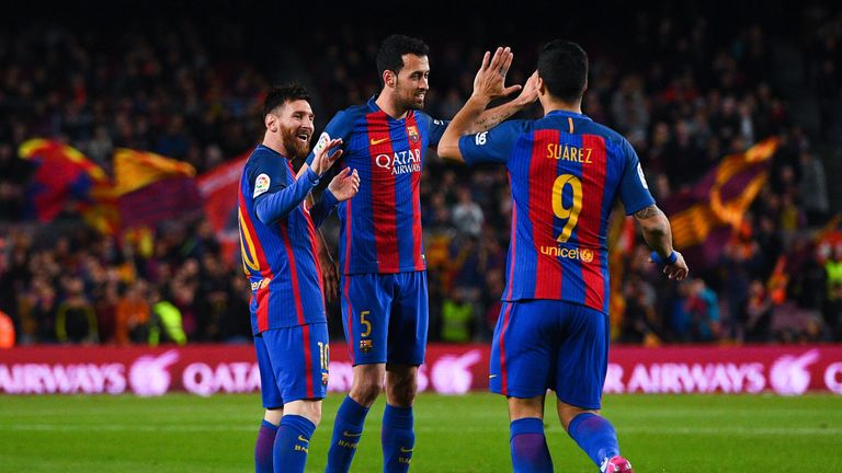BARCELONA, SPAIN - MARCH 01:  Lionel Messi of FC Barcelona celebrates with his team mates Sergio Busquets and Luis Suarez of FC Barcelona after scoring the