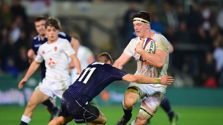 NORTHAMPTON, ENGLAND - MARCH 11 2017:  Ben Curry  of England U20 is tackled by Darcy Graham of Scotland U20 during the Under 20s Six Nations