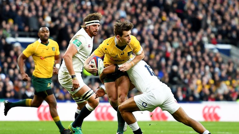 Bernard Foley is tackled by Mike Brown (R) during the Old Mutual Wealth Series match between England and Australia