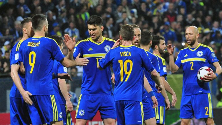 Bosnia and Herzegovina's Vedad Ibisevic (2ndL) is congratulated by his teammates after scoring his second goal during the FIFA World Cup 2018 qualification