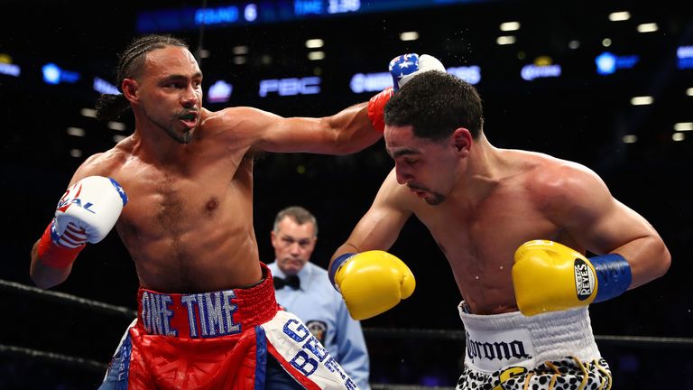 Keith Thurman punches Danny Garcia during their WBA/WBC Welterweight unification Championship bout 