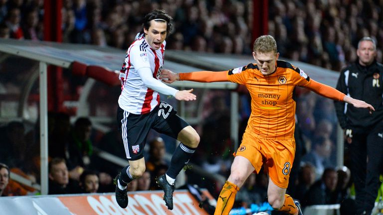 BRENTFORD, ENGLAND - MARCH 14: George Saville of Wolves and Jota of Brentford FC Spain during the Sky Bet Championship match between Brentford and Wolverha