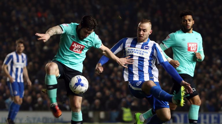 Derby County's Jacob Butterfield (left) is challenged by Brighton & Hove Albion's Jiri Skalak during the Sky Bet Championship match at the AMEX Stadium