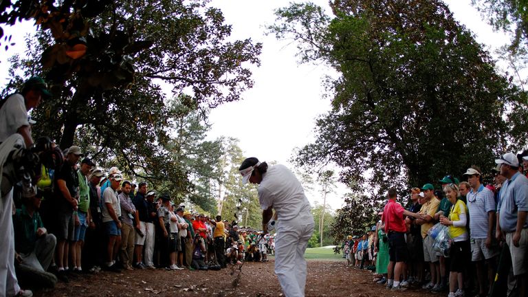 AUGUSTA, GA - APRIL 08:  Bubba Watson of the United States plays at a shot from the rough on second sudden death playoff hole on the 10th during the final 