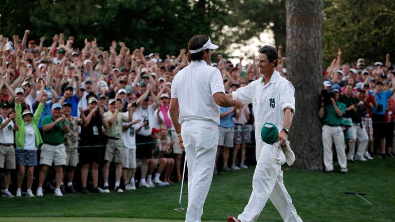 AUGUSTA, GA - APRIL 08:  Bubba Watson (L) of the United States hugs his caddie Ted Scott after  winning his sudden death playoff on the second playoff hole