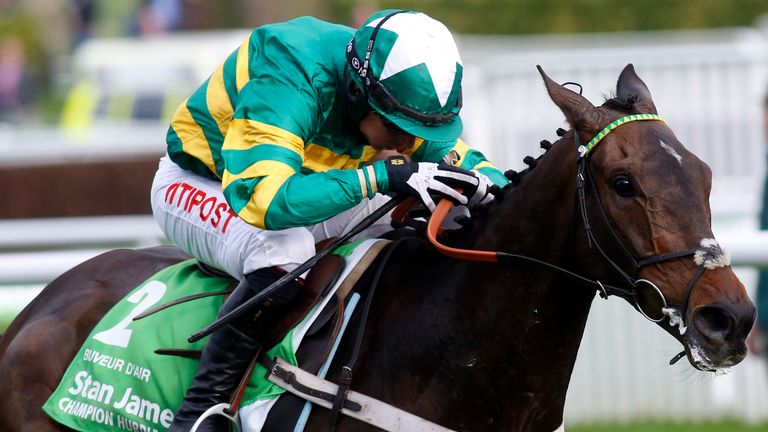 Buveur D'Air, ridden by Noel Fehily, leads the field before going on to win The Stan James Champion Hurdle